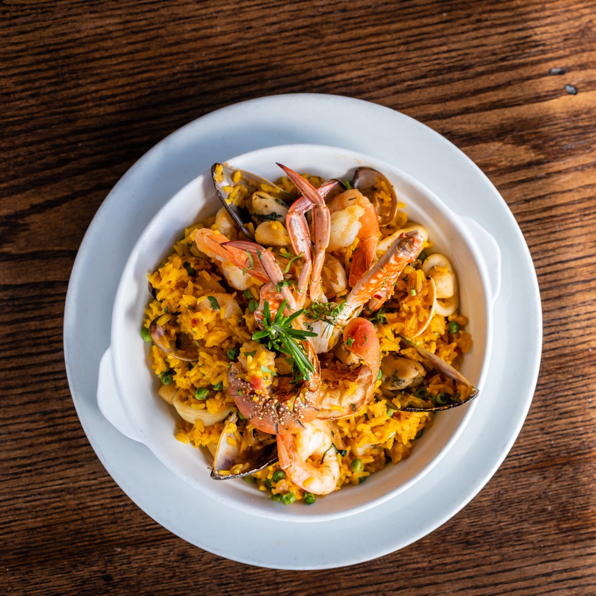 A bowl of our seafood paella is sure to make any day better. Come in for one soon!