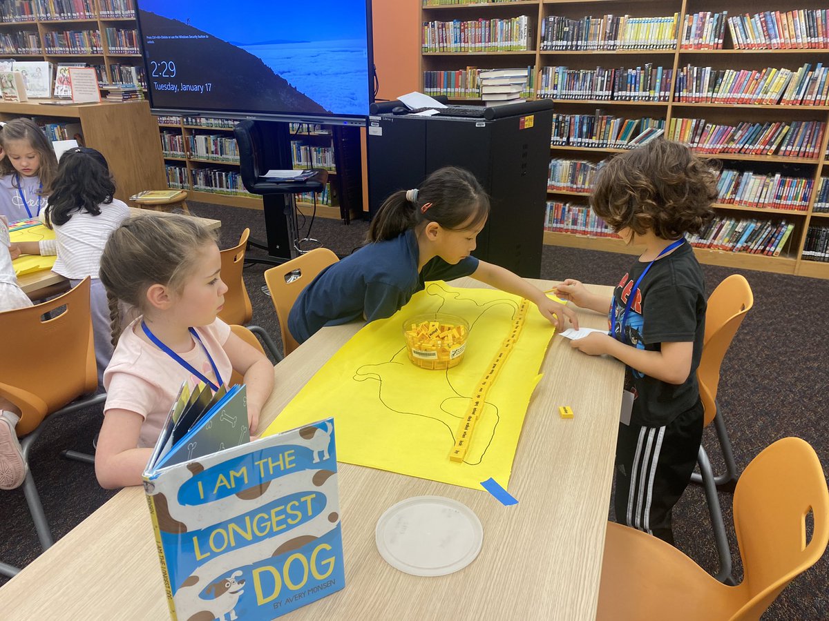 Ms. Gleason’s kinder class practicing non-standard measurement after reading I Am the Longest Dog by @averymonsen ❤️🐶 #librariesrrock