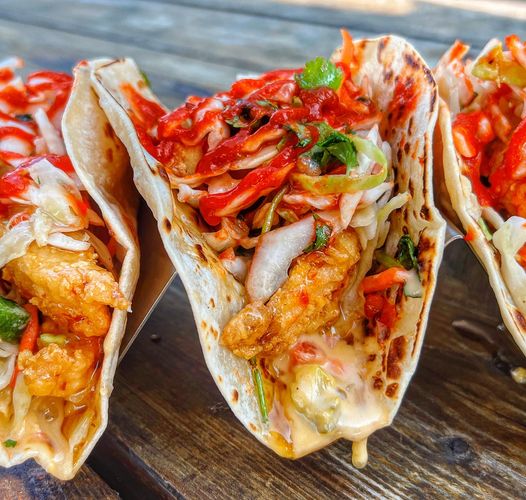 Hot take: fried chicken is best served with queso.

📸 The Uptown taco: fried chicken, queso, honey, slaw, and sriracha.