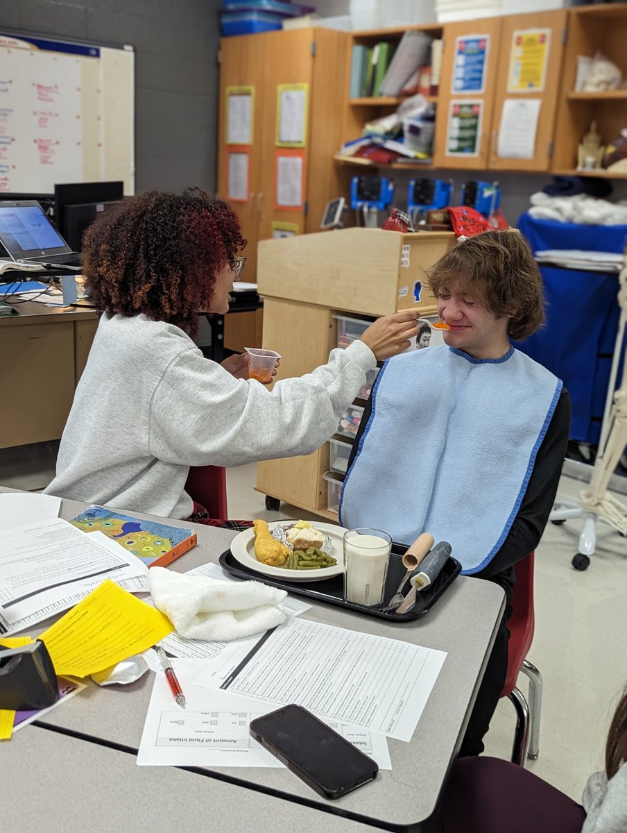 MetzgerMrs's tweet photo. Feeding a patient is an important skill!  Students practiced feeding each other and learned the importance of conversation during meal time 🥦🥣😋

#OneGrosseIle #CTE #DCTCEDU https://t.co/S6RvfYmKew