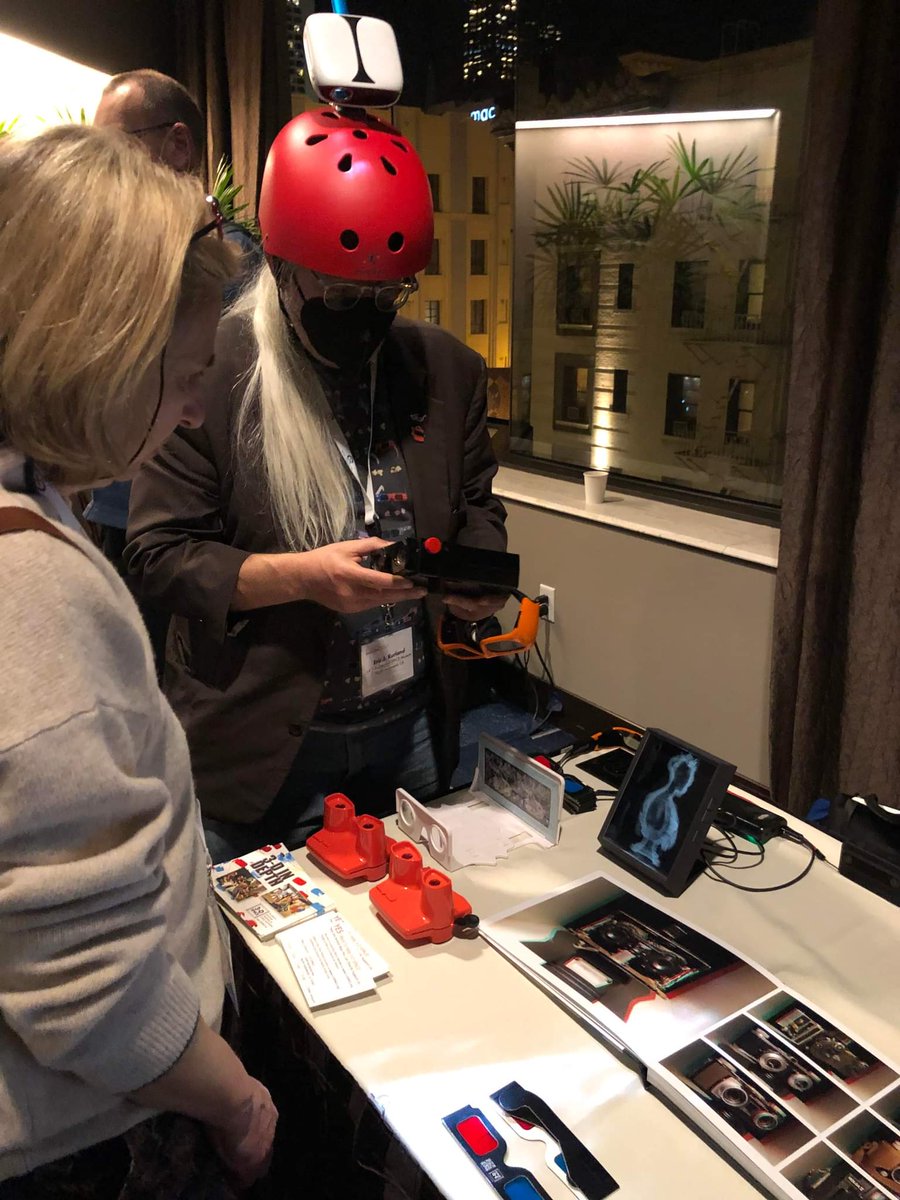 LA3DSpace's tweet photo. 3-D SPACE founder Eric Kurland @3_DIY shows items from the museum, during the demonstration session at the Stereoscopic Displays &amp; Applications conference @SDnAconf in San Francisco (including a helmet-mounted mobile 3-D movie theater).

Photos/video courtesy @AndrewWoodsAU https://t.co/KkbpQ07bme