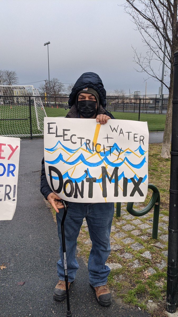 XRBoston's tweet photo. David & Goliath standoff continues at the East Boston substation construction site. Yesterday 6 were arrested on arrival. This time we came in greater numbers, and we brought a brass band. #Neversource #NoEastieSubstation https://t.co/xFDdXwkFZw