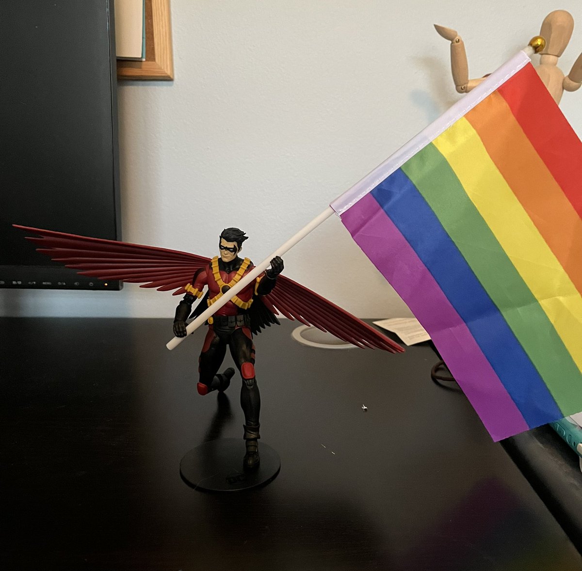 _CheeseSlice_'s tweet photo. I bought this Red Robin figurine at Walmart, and he came with a bo staff, but his hands are the perfect size to hold this pride flag I owned lol https://t.co/v6jNf32MLV