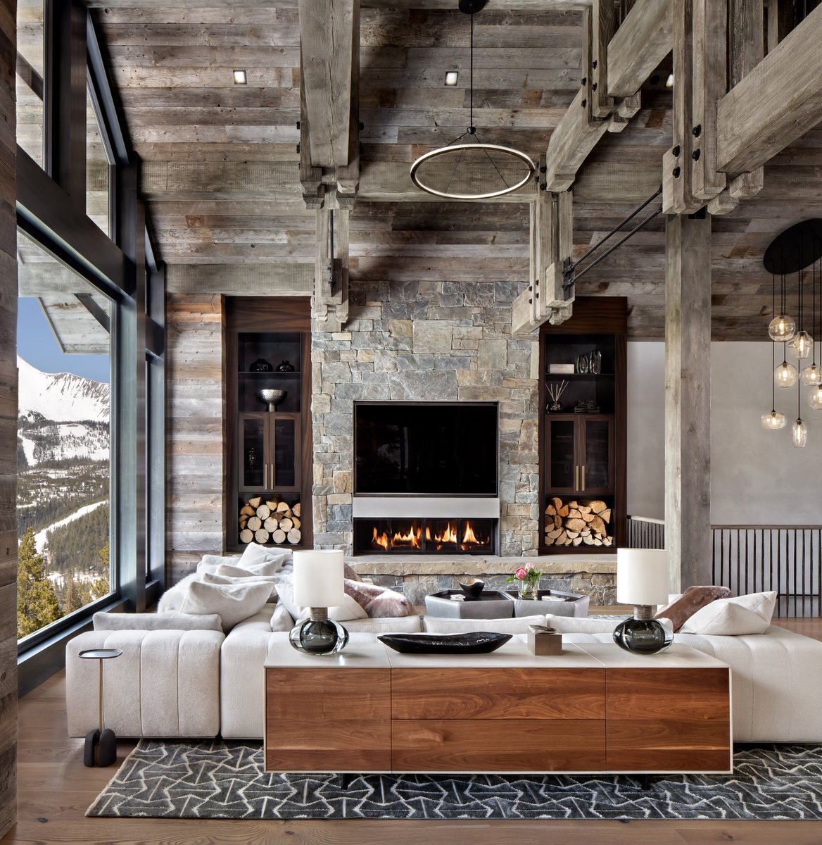 The comfort of a fireplace has come a long way – now it’s as simple as the touch of a button. We love the considerate, inviting details of this indoor &amp; outdoor space. 

🏠: Studio H 
🛋️: Shelter Interiors
🛠️: Lohss Construction
--
📸: Gibeon Photography