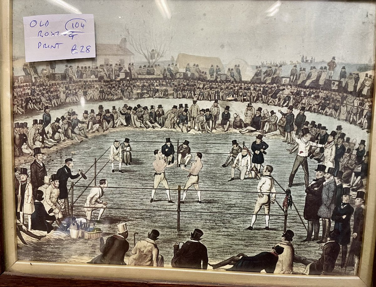 SOTRP's tweet photo. @bigdaddybunce need help with some history. I found this old print nothing unusual about the main scene, but why are there 4 men in each corner? Do you think this comes when public could try their luck against fighters aka like at Ron Taylor's boxing booth at the goose fair? https://t.co/uFaDdUjJRo