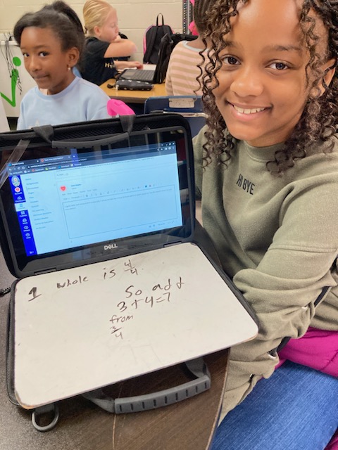 IC_Kirkpatrick's tweet photo. @MrsJTukes @car_laurie Mrs. Carpenter's 4th graders are justifying their mathematical thinking! How many fourths are in 1 3/4?  Susie says there are 4 fourths, and Jack says there are 7 fourths.  Who do you agree with?  How do you know they are right? #SMP3 #ncssbethebest https://t.co/3DXMs74lp0