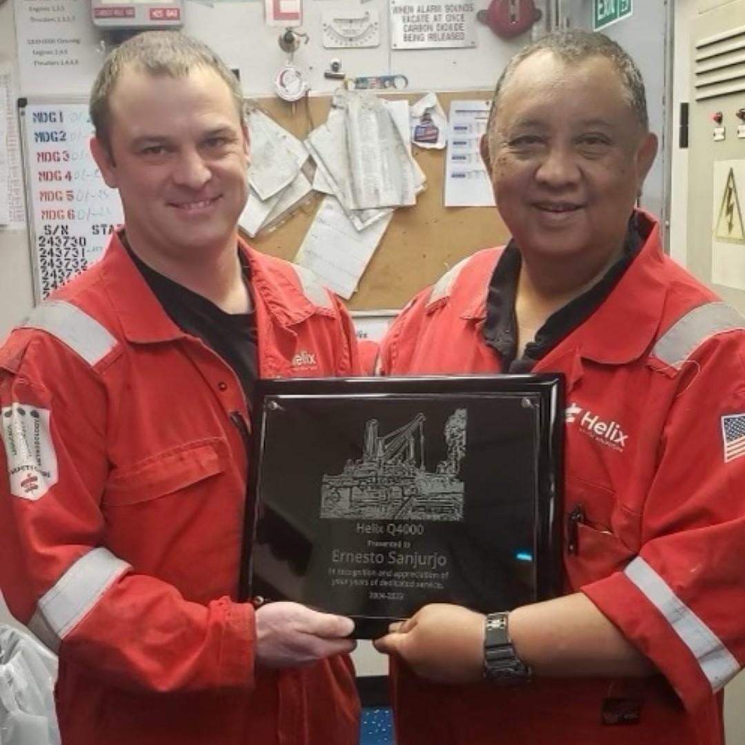 Helix_ESG's tweet photo. πππ Chief Engineer Elijah Arbo presented 3rd Assistant Engineer, Ernesto βErnieβ Sanjurjo a plaque for 19 years of service onboard the Helix #Q4000. Fun fact: Ernie started as a QMED, moved up to a mechanic, and is retiring as a 3rd A/E! #HelixESG #HLX https://t.co/m45RfIPppt