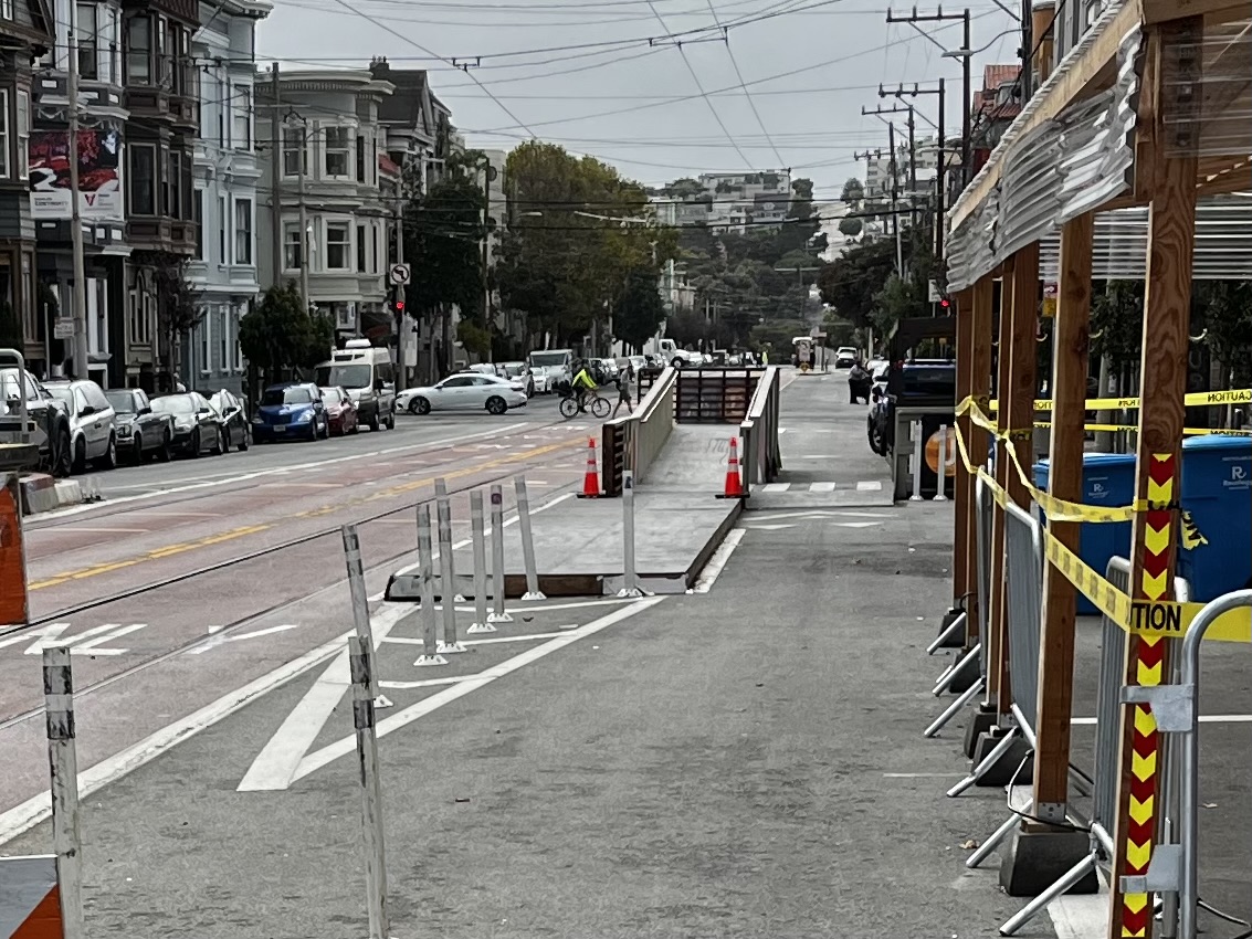 This morning, an <a href="/SFMTA_Muni/">SFMTA</a> crew was removing the street markings around the accessible boarding platform at the Church &amp; Market.

I hope they are extending the platform they built too short to fit a bus + train, or even a single train making board from the street between posts.