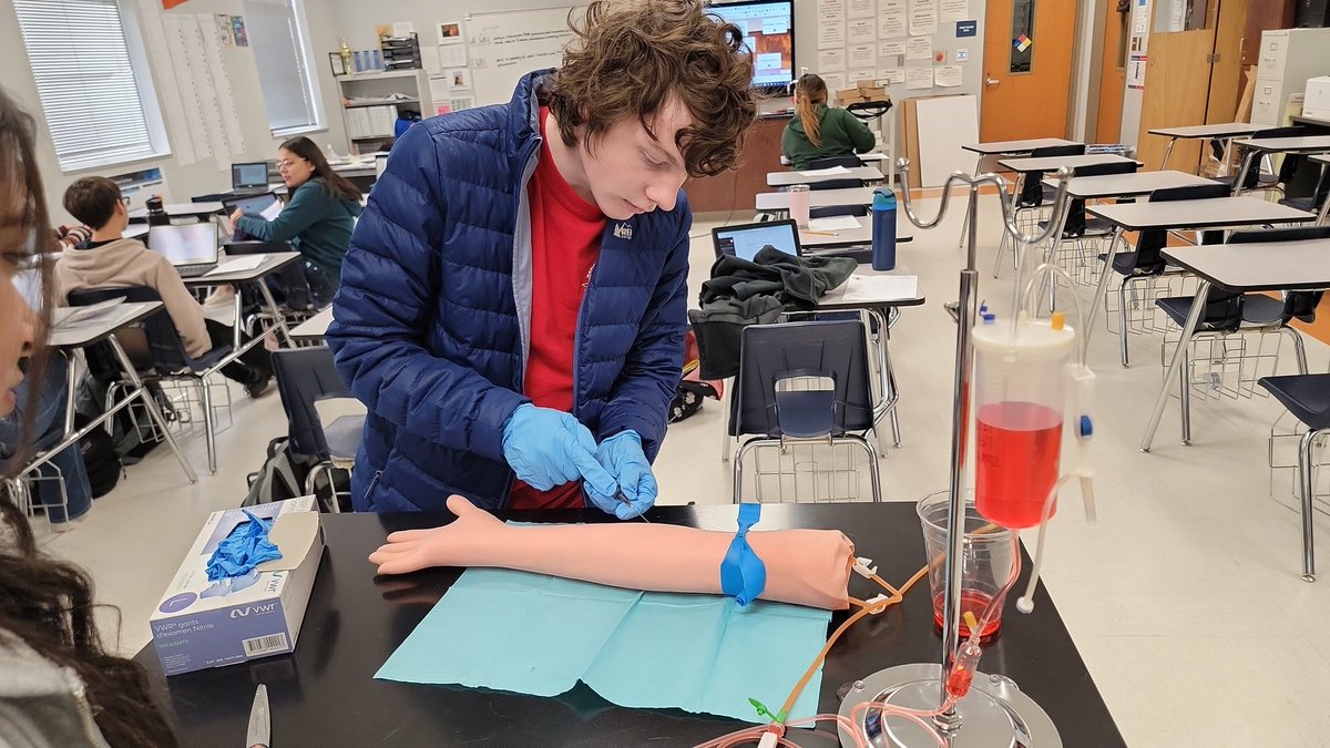 Clint High School PLTW biomedical science, drawing blood from a phlebotomy arm. @ClintHSLions