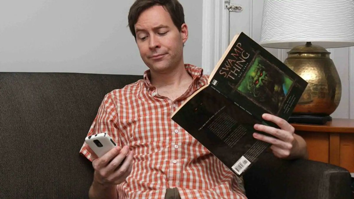 'Jesus, What Is It Now?' Says Man Putting Down Swamp Thing Comic To Answer Phone Call From Wife bit.ly/3XTXXzc