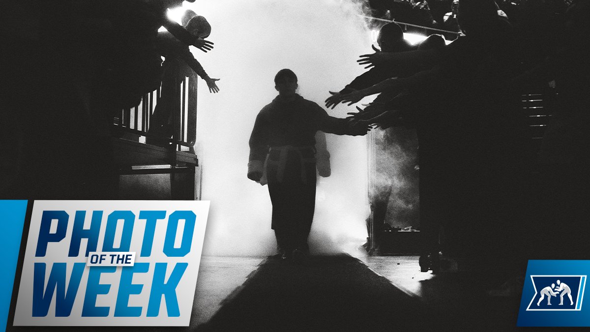 NCAAWrestling's tweet photo. 📸 #NCAAWrestling Photo of the Week

Fans reach for high fives as the team walks out of the tunnel in the famous @CycloneWR robes. https://t.co/P2cHTgRMSx