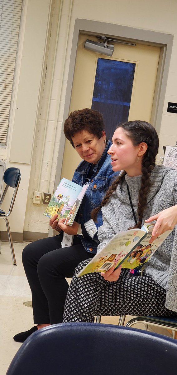 Dr. Becky Schou and Ms. Eva Fialkowski read "Happy Within" to children at the Lexington Park Elementary "Tertulia".