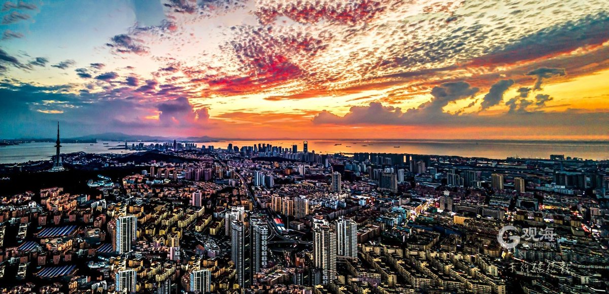 Aerial photography of Qingdao city scenery under the beautiful sunset.