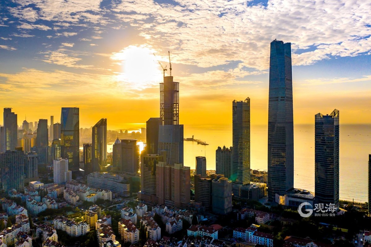 A beautiful view of Qingdao Qianhai enveloped by golden light.
