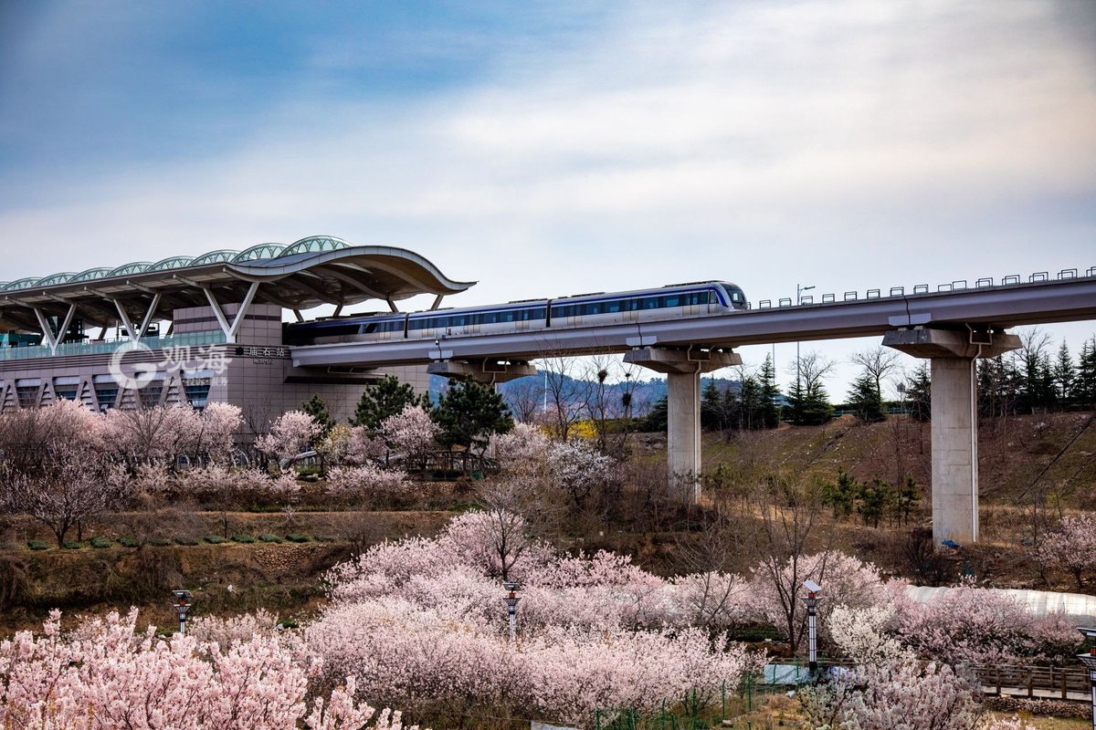 Laoshan Miaoshi Village, from which the light rail train passes.