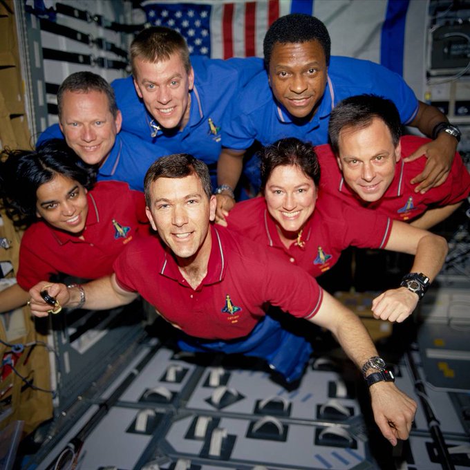 Group photo of the crew of STS-107 floating in microgravity aboard Space Shuttle Columbia. Clockwise from top left: David Brown, Willie McCool, Michael Anderson, Ilan Ramon, Laurel Clark, Mission commander Rick Husband, and Kalpana Chawla.