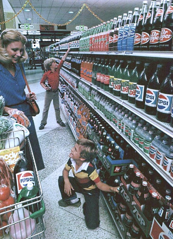 Grocery store, circa 1985

Glass bottles everywhere...

Before everything we consumed became encased in plastic