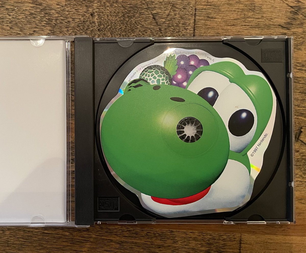 MartyElmer's tweet photo. Do you remember the weird rare N64 soundtrack CDs shaped like Yoshi and Diddy Kong’s head? Well, wanna buy mine? https://t.co/ucz08mS85a https://t.co/STWmLdovkV