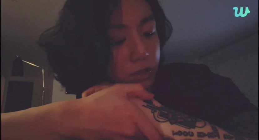 whatBTSsaid's tweet photo. This was a cover up. Hidden inside is the date he came up to Seoul. Some tattoos have meaning some don’t. His birth flower. The time is the time he was born (3:25? 3:23?). It’s connected by a chain to a microphone and a music note - he wanted to say he was born to be a singer. https://t.co/j6NYWQxEoa
