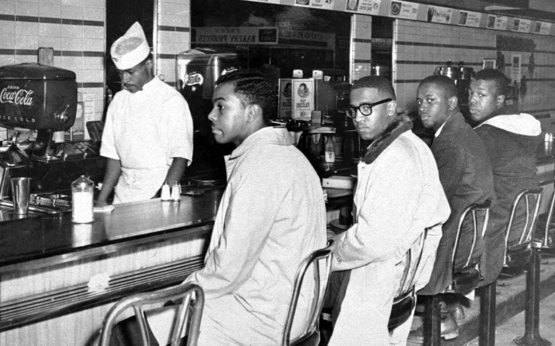 CommonCauseNC's tweet photo. Today in 1960, four @ncatsuaggies students sat at a whites-only lunch counter in Greensboro, challenging the injustices of segregation. These young Black men inspired a sit-in movement that spread across the nation: https://t.co/xipNpbmDV8 #BlackHistoryMonth https://t.co/WrGnYOAZ3C