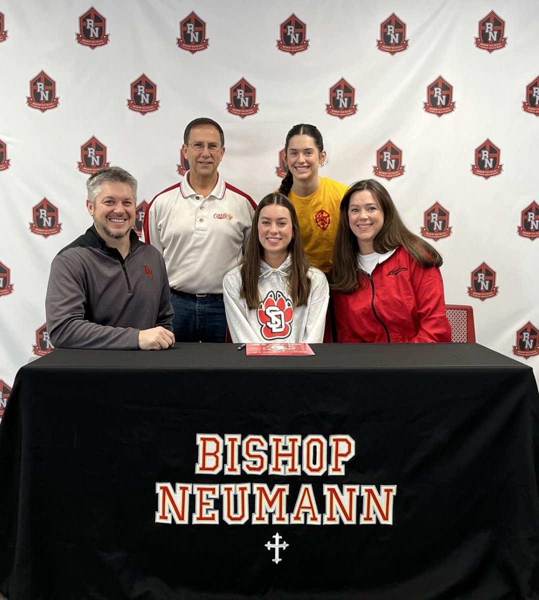 Congratulations to Kinslee Bosak who signed her letter of intent to continue her athletic and academic career at the University of South Dakota. #NeumannProud #MadeforMore #RollCavs