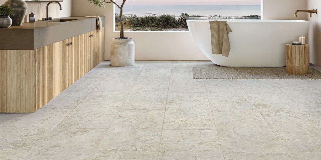 SNEAK PEEK: Capturing the look of natural travertine, Rapolano is an 18” x 36” stunning ADURA®APEX LVT stone visual which blends earth-colored mineral deposits with textural variation and will be available in stores July 2023. Learn more: Mannington.com/Rapolano #TISE2023