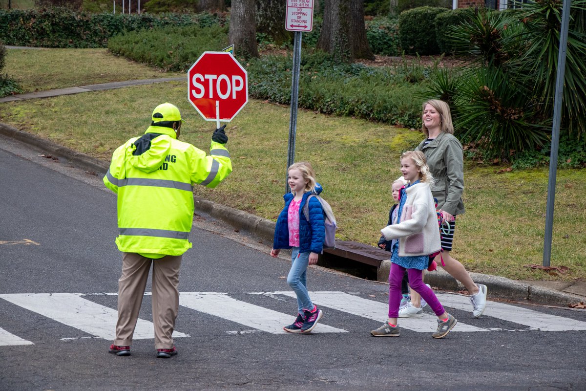 🛑🎉 Congrats to Ms. Teresa Gill, a <a href="/raleighpolice/">Raleigh Police</a> crossing guard at <a href="/DouglasESDragon/">Douglas Elementary</a> and <a href="/JYJoyner/">Joyner Elementary</a>, who received the Community Hero Award from @raleighapex NAACP! Her two and four-legged supporters showed up in droves with cookies and signs in hand! More: bit.ly/3JtnTNT