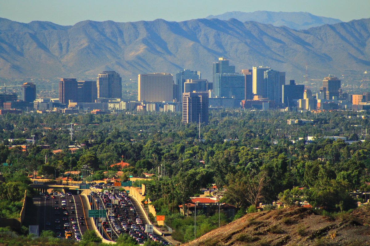 calebautr's tweet photo. @CityofPhoenixAZ @Chiefs @AZSuperBowl How are you all this dense? I took this picture from the same vantage point. Looks like they added the mountains into the foreground but this view is just north of Dreamy Draw Rec Area https://t.co/Y3E4MSQuoS