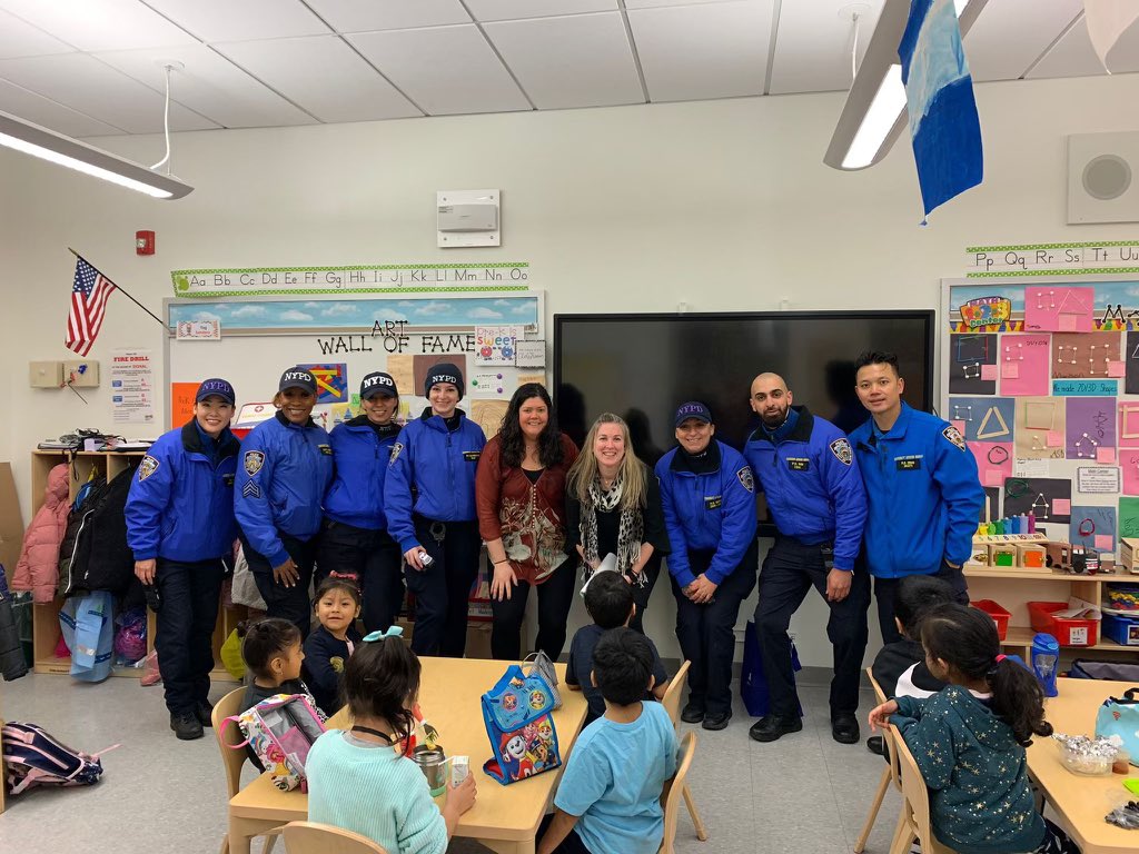 NYPD officers meeting with community members