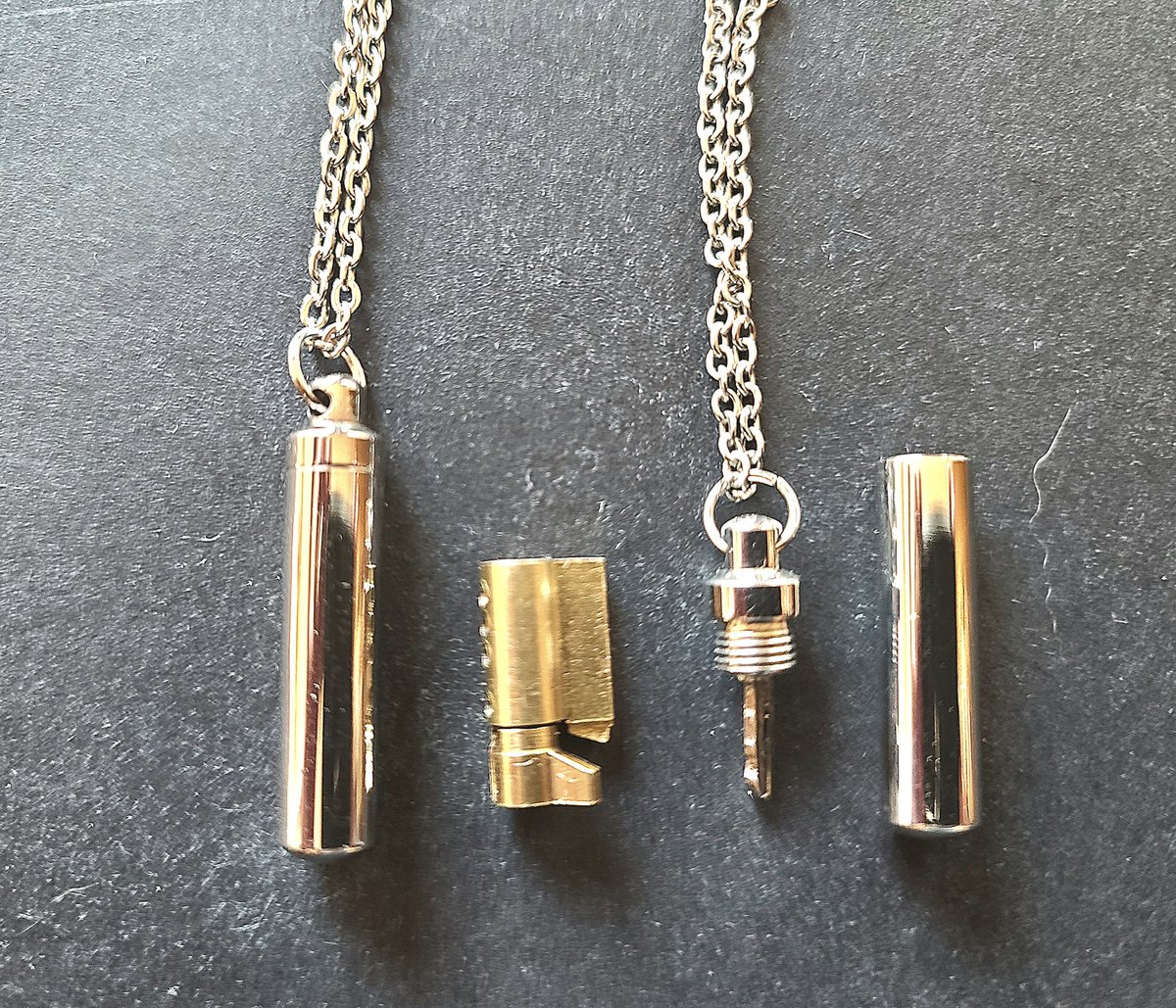 LockedinL's tweet photo. The Secret Chastity  Key has been popular.  Subtle way to carry his key. He will know where the key is hanging.
https://t.co/QLhs35gvC9 https://t.co/u9Jej2eFhB