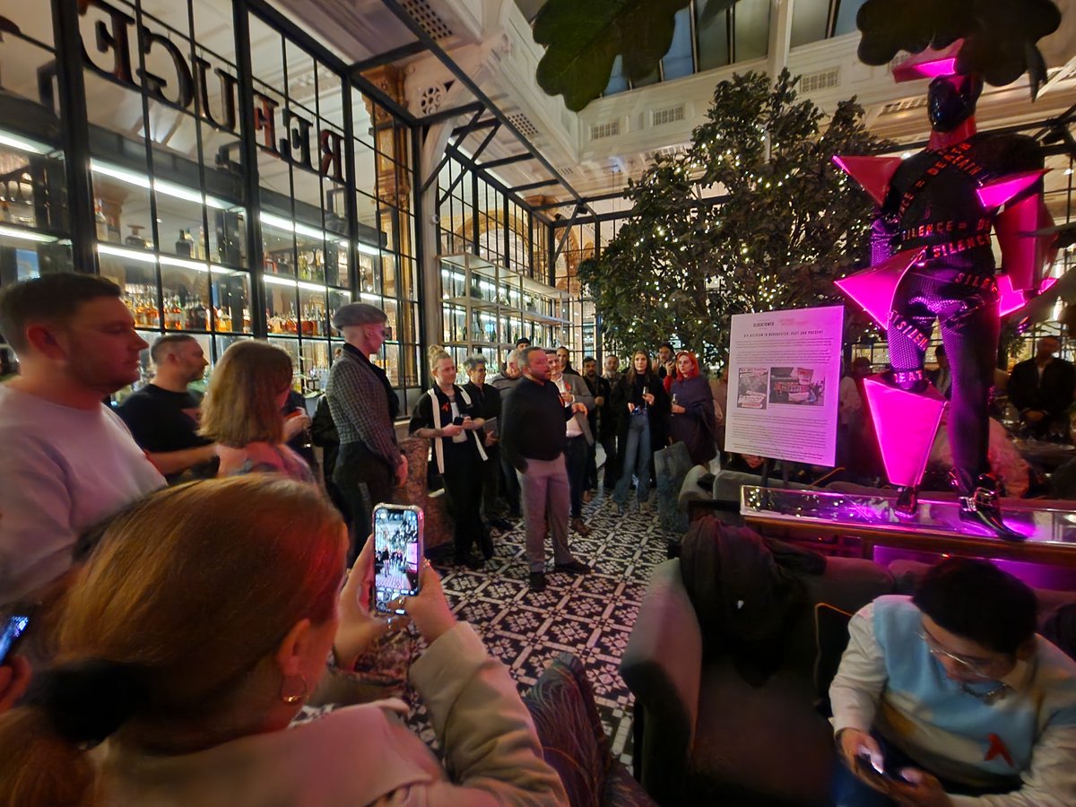 Last night, we launched an exhibition of our ambassador @cheddargorgeous’ powerful Pink Triangle outfit to mark LGBTQIA+ history month. Thank you Cheddar @mbpearl and Paul Fairweather for your inspiring words on the night and to @TheRefugeMcr & @Kimpton Clocktower for hosting!