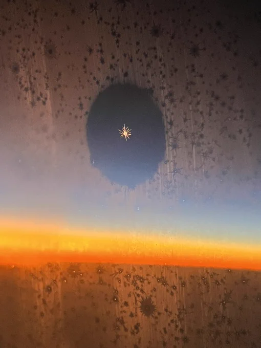 Some pics I took on the planePic 2 is Kokomi ascending lmaoAnd pic 3 is a single snowflake that's on our window!! I'm quite impressed that my phone managed to capture it! 