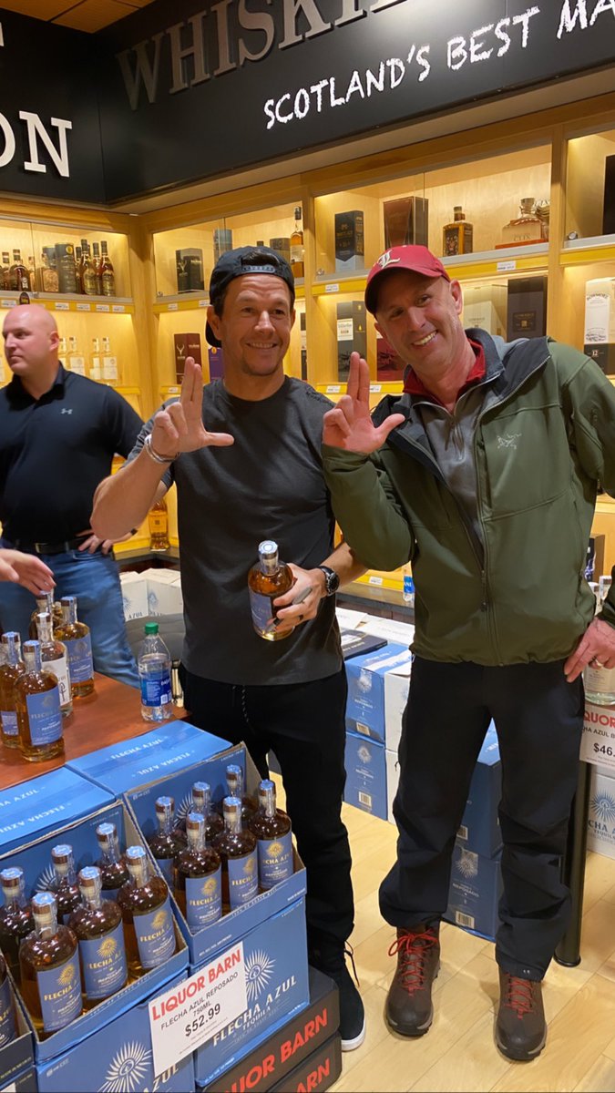 UofLSheriff50's tweet photo. Mark Wahlberg throws up the L at Liquor Barn. https://t.co/VHGfBpNGec