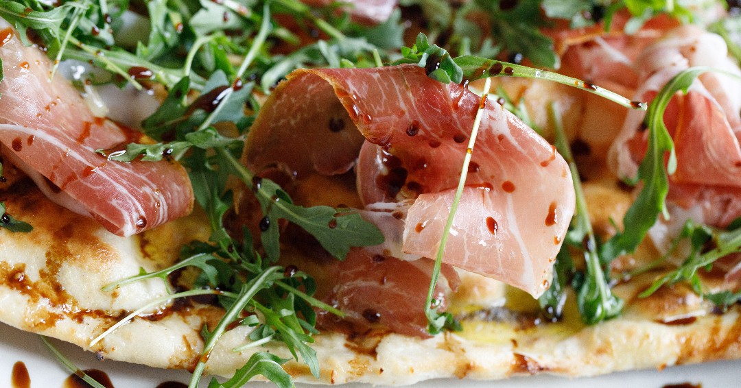 Our tandoor oven bakes the best naan 🤤 We top this one with prosciutto, arugula, &amp; balsamic glaze.. #SeeYouAtScampo