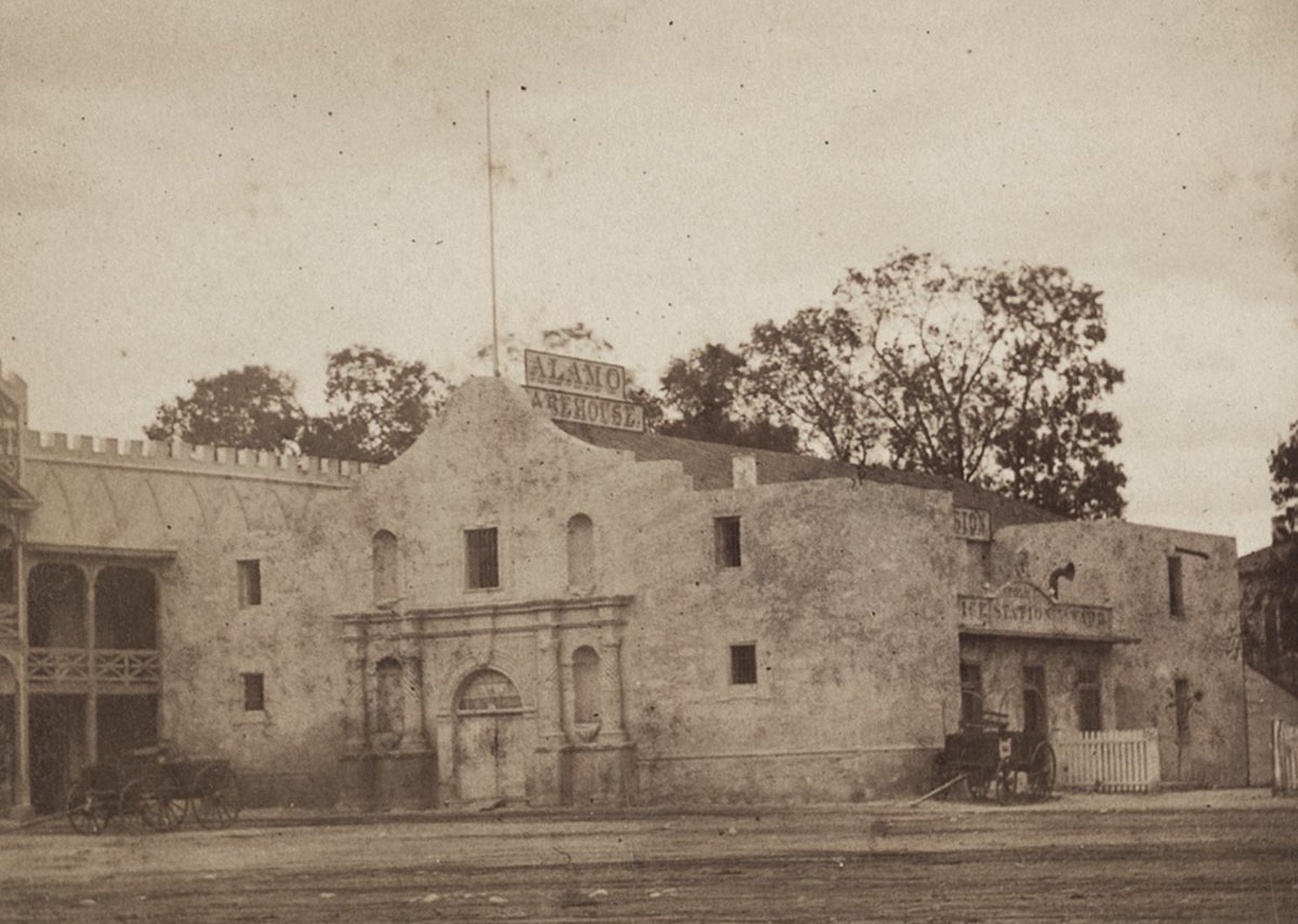 The Alamo circa 1875, back when it was a commercial warehouse (!)  See the sign on top: Alamo Warehouse.

<a href="/OfficialAlamo/">The Alamo</a>