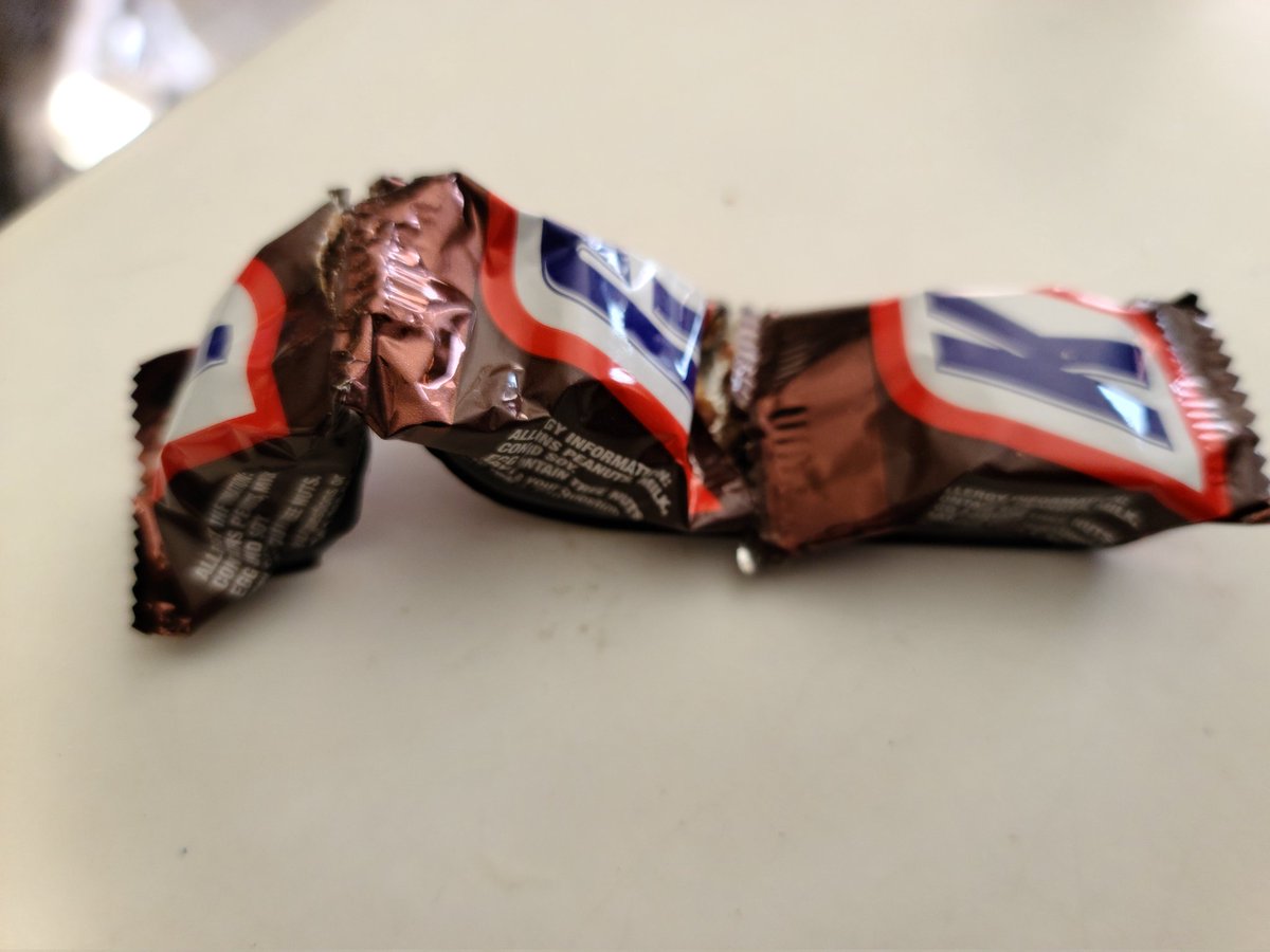 Freaksdesign's tweet photo. Hey @SNICKERS looks like the minis have a quality control problem. They came stuck together and opened 😞 https://t.co/HmfVUH5uki