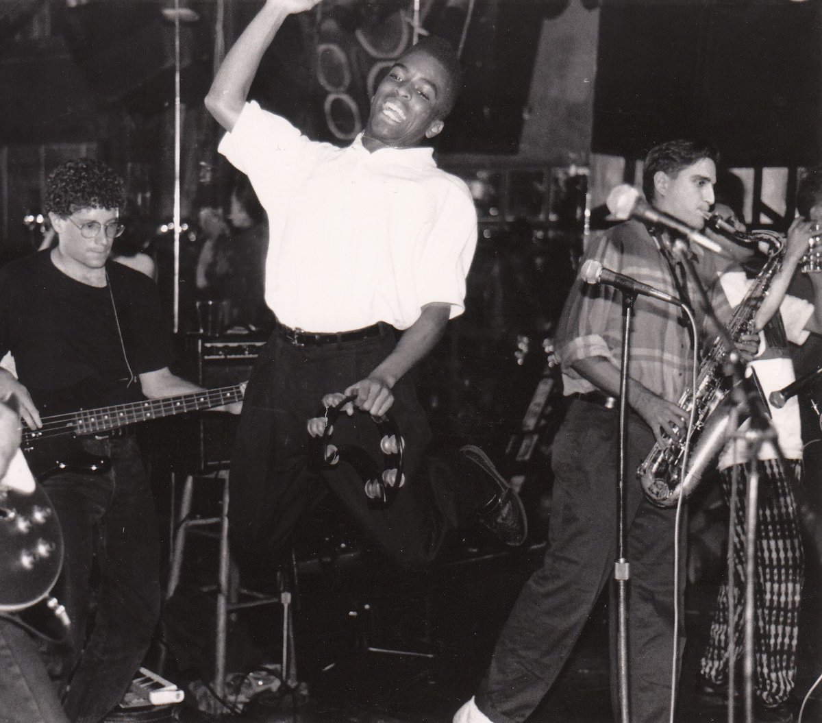 Here's a picture from the heyday of <a href="/BiggerThomasSka/">Bigger Thomas</a> taken at the QE2 in Albany, NY sometime in 1989 or 1990.  The look of pure joy on Roger's face-- let alone the height on his leap -- is in stark contrast to the look of concentration and fear on my face!