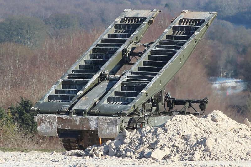 ArmouredSapper's tweet photo. Armoured Sappers from Perham Down with Titan AVLB conducting bridge launches with the BR90 No 12 Close Support Bridge (CSB) on the RETA on Salisbury Plain.🦾

Note the use of Warrior as the engineer recce veh now, as CVRT has gone out of service.

#ArmouredEngineers #Titan #AVLB https://t.co/9SYREouWXm