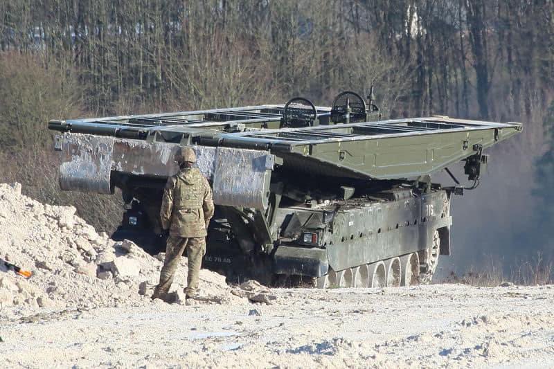 ArmouredSapper's tweet photo. Armoured Sappers from Perham Down with Titan AVLB conducting bridge launches with the BR90 No 12 Close Support Bridge (CSB) on the RETA on Salisbury Plain.🦾

Note the use of Warrior as the engineer recce veh now, as CVRT has gone out of service.

#ArmouredEngineers #Titan #AVLB https://t.co/9SYREouWXm