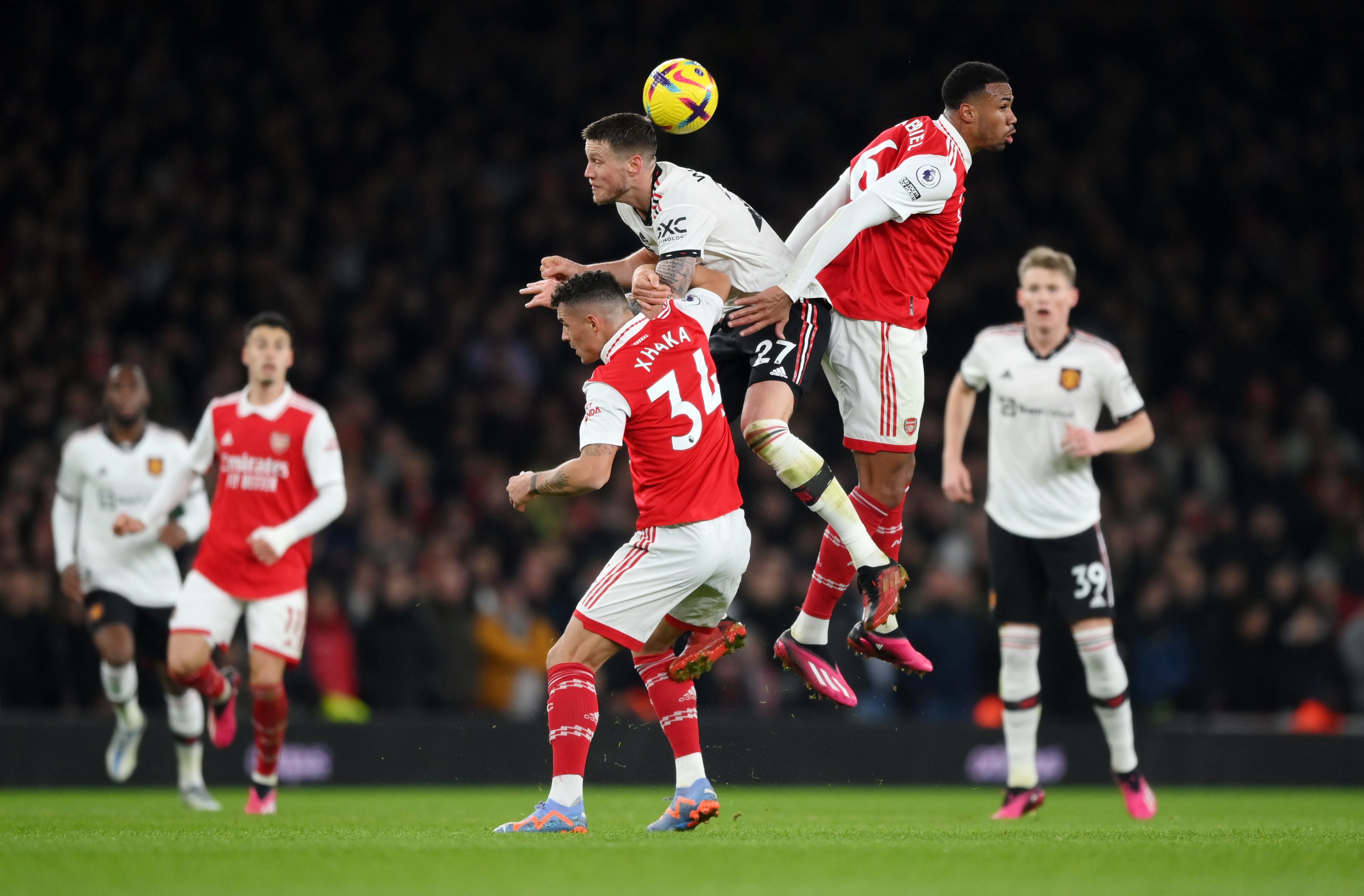 Weghorst challenges in the air.