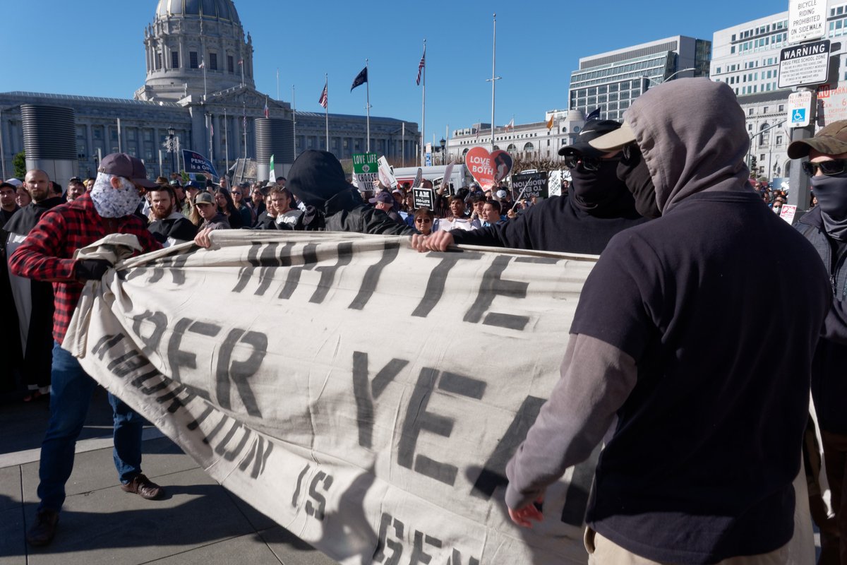White supremacists proudly marched with the so called "March for Life" and attacked the pro-choice counter-protesters. The banner reads "150K White Kids Per Year, Abortion Is Genocide" What does this say about the racism, misogyny, and fascism of the anti-abortion movement?