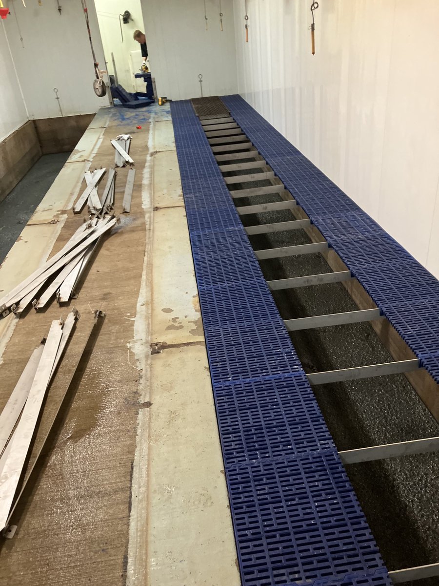 Old rubber coated floors out and new stainless rails, plastic sow slats, used existing cast and crate