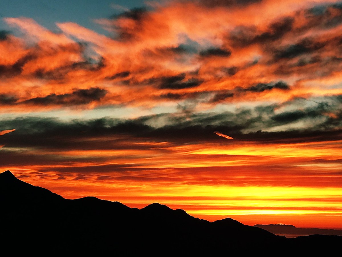 This morning January sunrise from the #GaviotaCoast framed by the #SantaYnez Mountains above #SantaBarbara with Mount Allen #SandstonePeak in the #SantaMonicaMountains at far right 70 miles away !