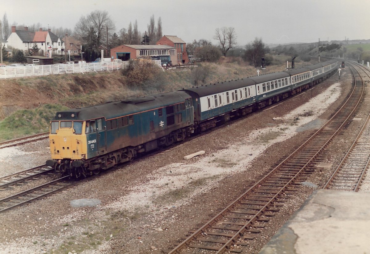 Clay Cross 21st April 1987
A taxing load for British Rail Blue liveried Class 31/4 diesel loco 31443 as it hauls the 07:20 Blackpool to Harwich service
9 Bogies on for a Goyle - recipe for lateness!
#BritishRail #Class31 #ClayCross #BRBlue #trainspotting #Blackpool #Harwich 🤓