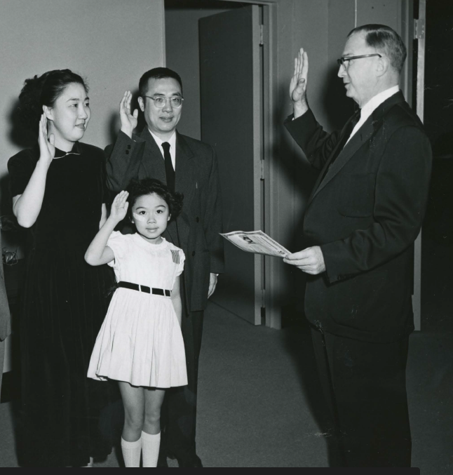 Historic black and white photo of the Chen family, who naturalized in 1955. They came to the U.S. from China in 1950. Mr. Sung Chiao Chen, center, worked for the Voice of America, and his daughter Frances derived her citizenship through her parents.