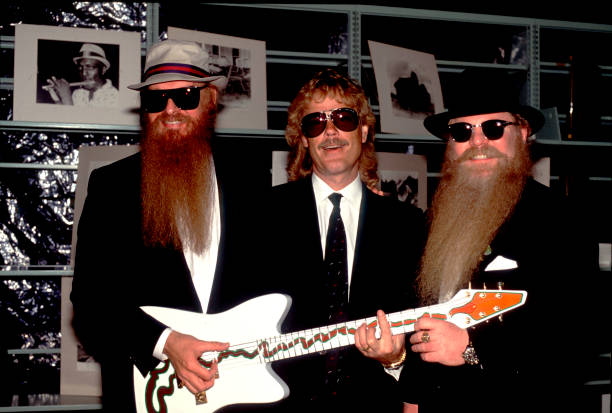 bluezharp's tweet photo. Members of the American Rock group ZZ Top present the 'Muddywood' guitar to the Carnegie Public Library's Delta Blues Museum, Clarksdale, Mississippi, in 1988.
Photo by Paul Natkin/Getty Images https://t.co/jgXkjGrUWe