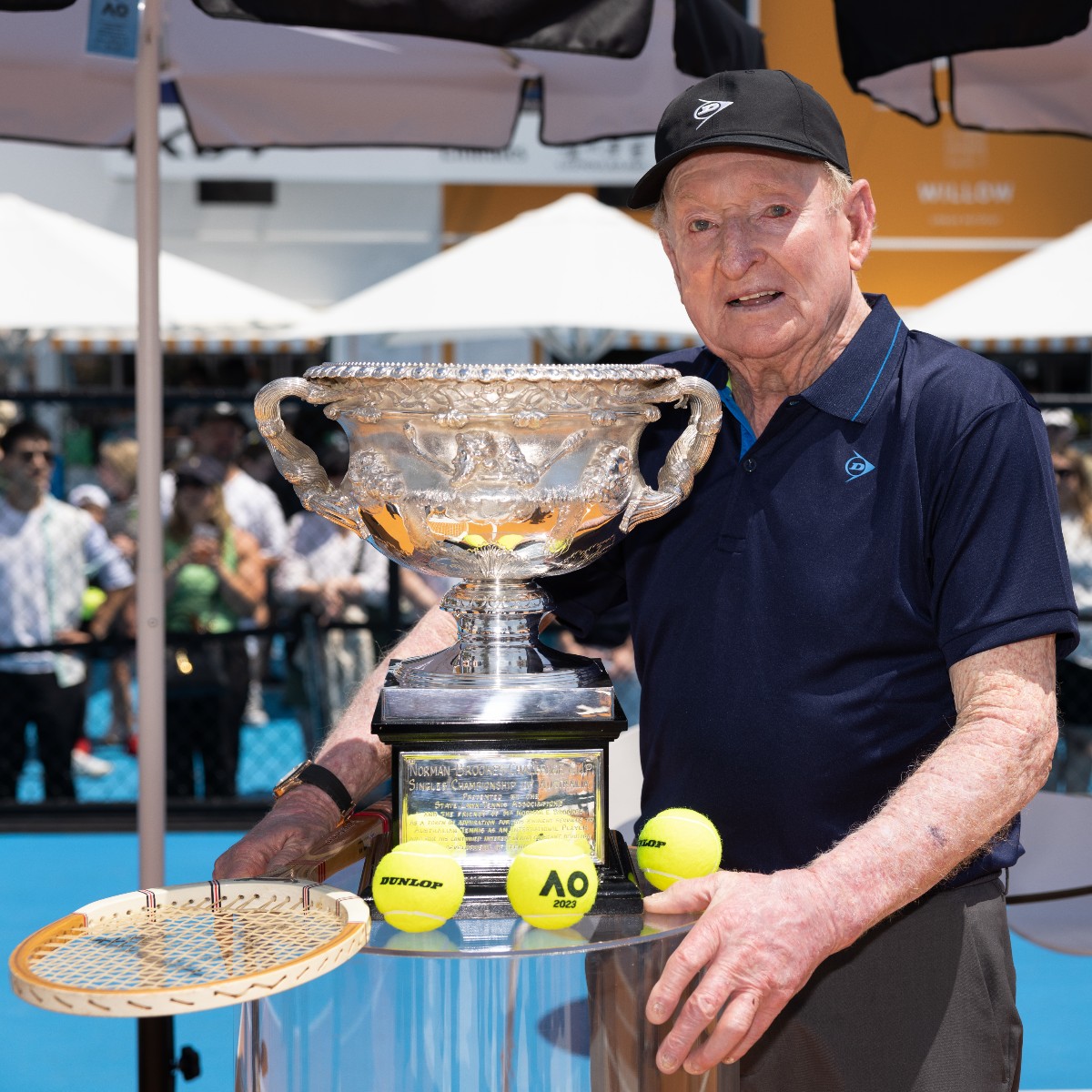 dunloptennis's tweet photo. It was an honour to have Rod Laver gracing the Australian Open again!
Rod took a trip down memory lane posing for photos with the AO trophy.
He answered some questions for the fans and signed some merchandise! A true legend of the game!
#TeamDunlop #RocketRod #AO2023 https://t.co/beCVJ0aq4J