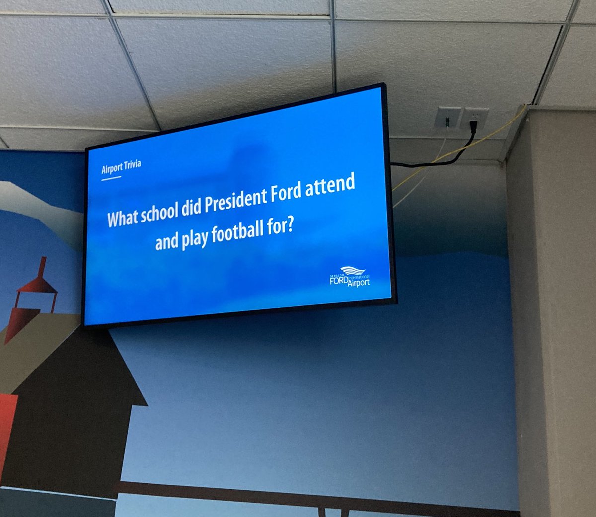 KenJennings's tweet photo. Instead of cable news, the Grand Rapids, Michigan airport just plays Gerald Ford trivia. More public places should do this, honestly. https://t.co/hyY2Tu9KrD
