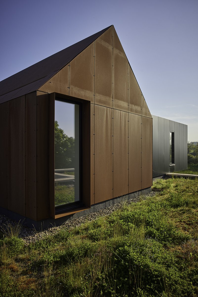 Corten steel and black trespa rainscreen cladding against the backdrop of a clear blue sky. #contemporaryarchitecture #contemporaryhome #contemporaryhouse #modernarchitecture #modernhome #modernhouse #barrowhouse #granddesigns #cortensteel #corten #trespa #livingroof #greenroof