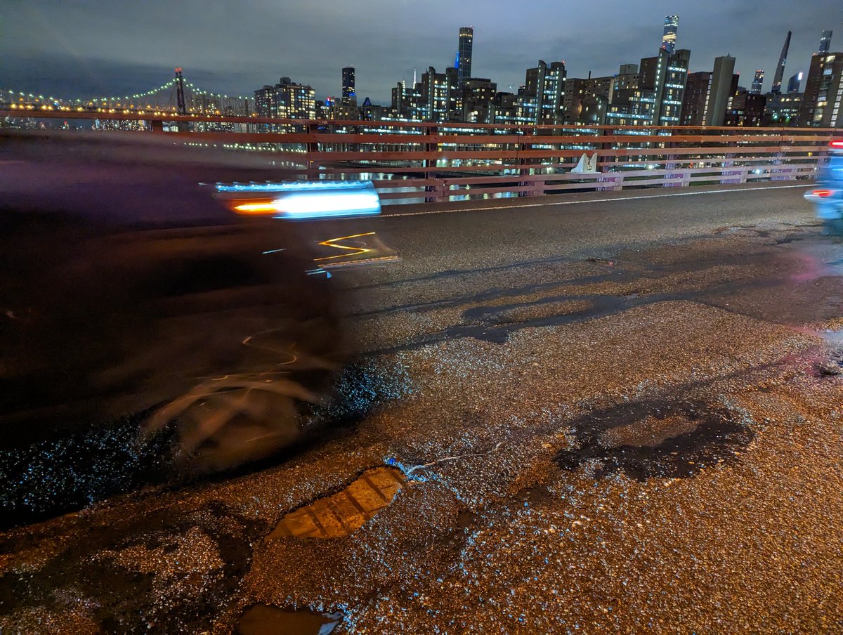 twowheelsg's tweet image. I tried new yellow plastic pads on Roosevelt Island Bridge after the rain -- they are not hideously slippery;
did not try one-handheld cel video while doing skids here.

Bridge ramp pavement is rough but reveals joy of #cobblestone era #pavés.